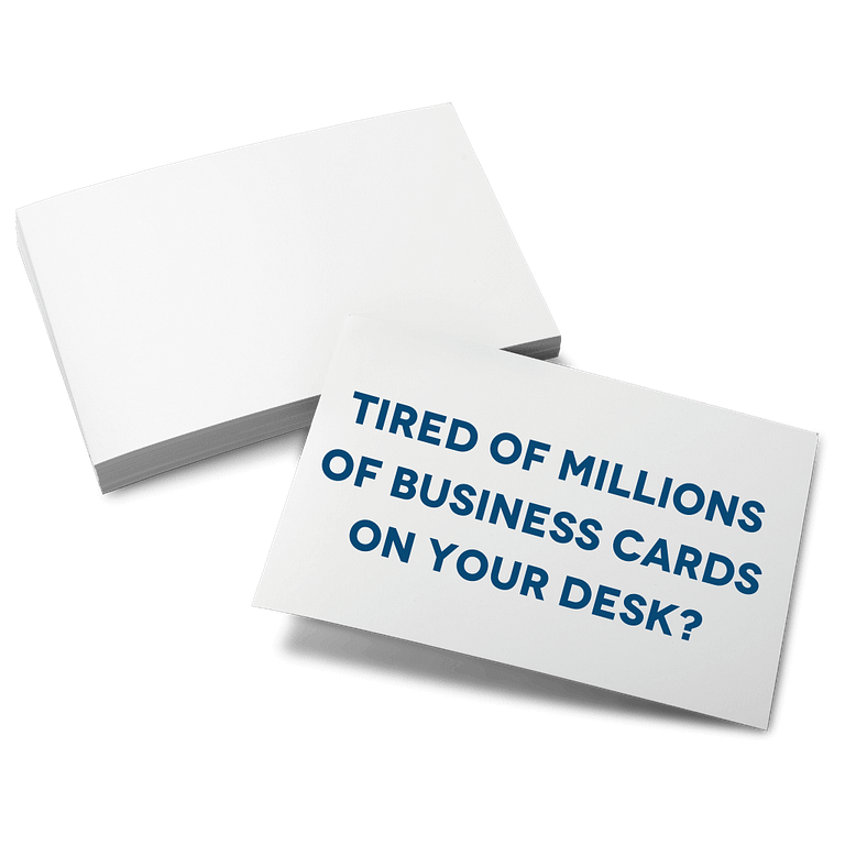 Stack of business cards saying tired of millions of business cards on your desk